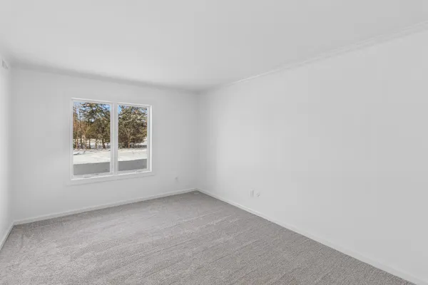 a bedroom with a bed and a walk in closet