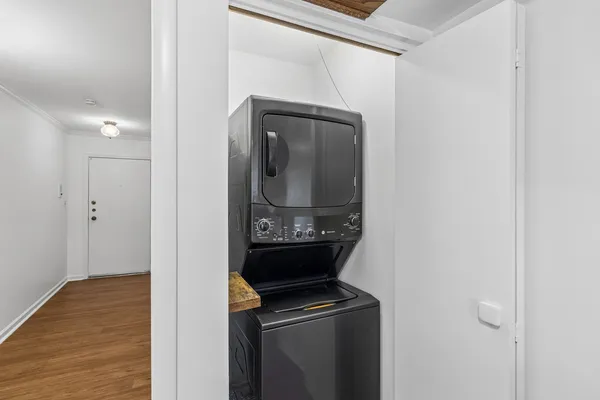 a view of hallway with wooden floor