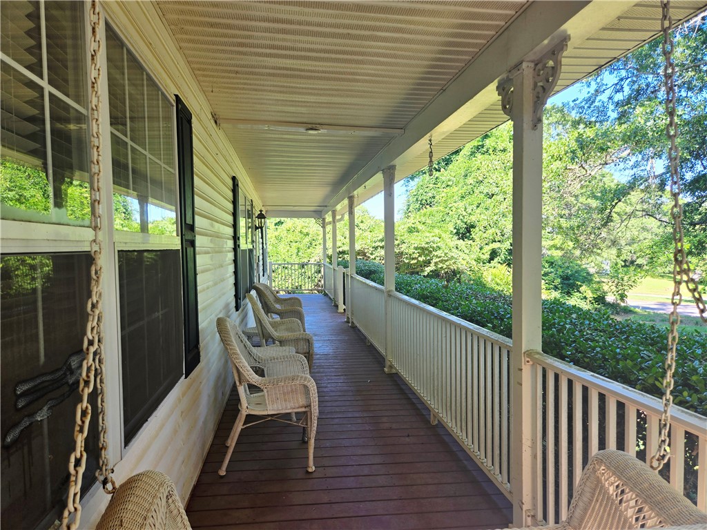 202 Keith Lane Seneca, SC 29678 - Photo 3 of 23 Relax in the shade on this deep, welcoming porch, offering tranquil views of mature landscaping.