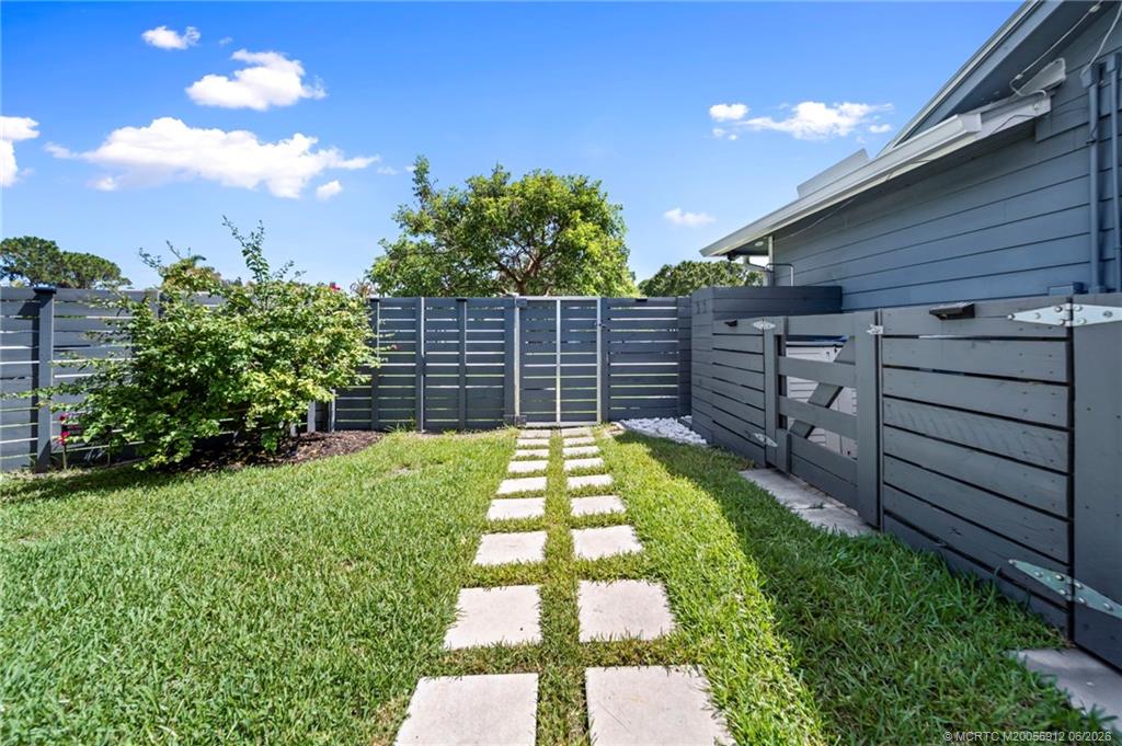 4401 Southeast Satinleaf Place Stuart, FL 34997 - Photo 40 of 51 Side Yard, Fully Fenced