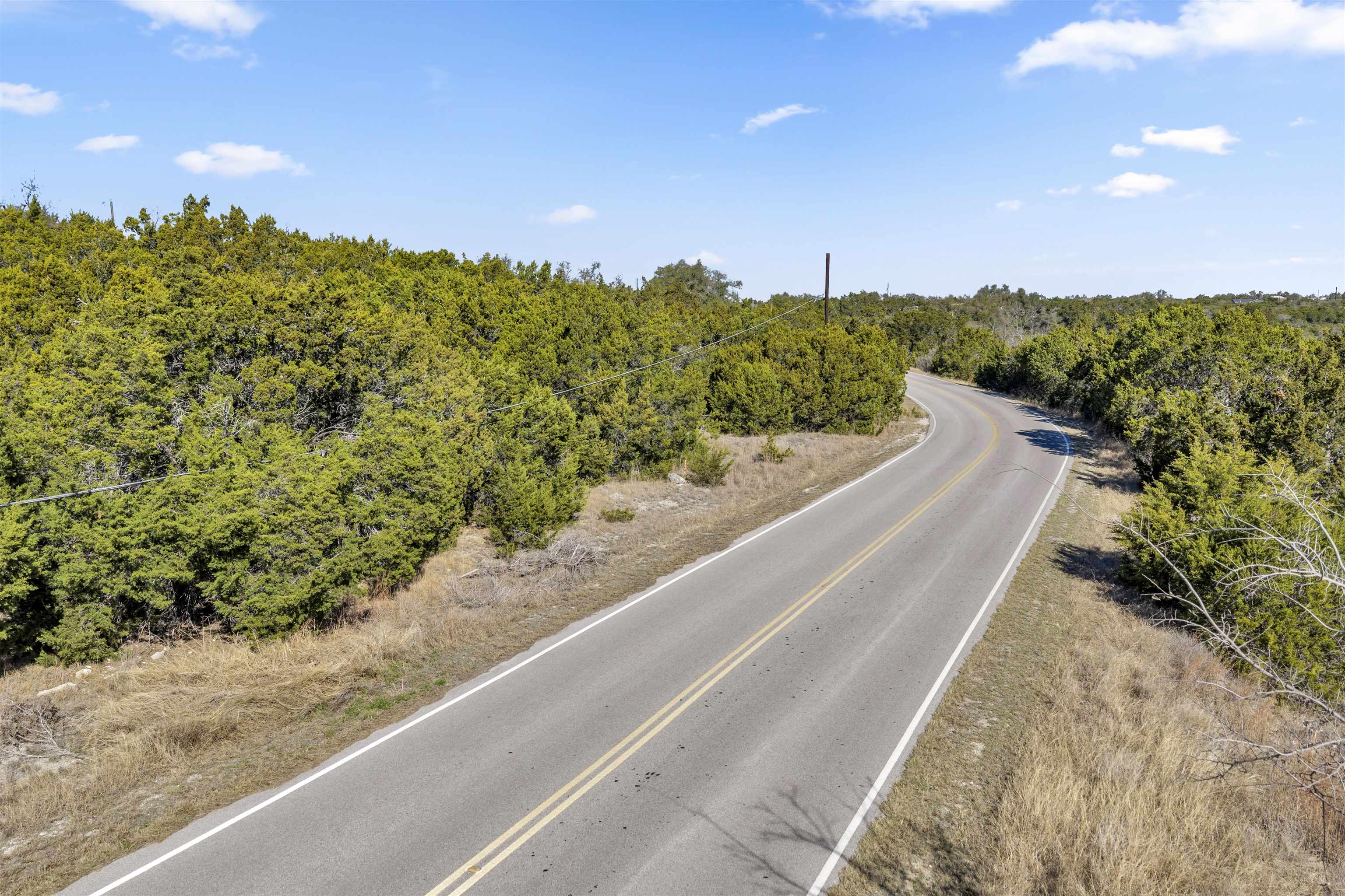 8614 Bar K Ranch Road Lago Vista, TX 78645 - Photo 13 of 26 a view of a city street from a balcony