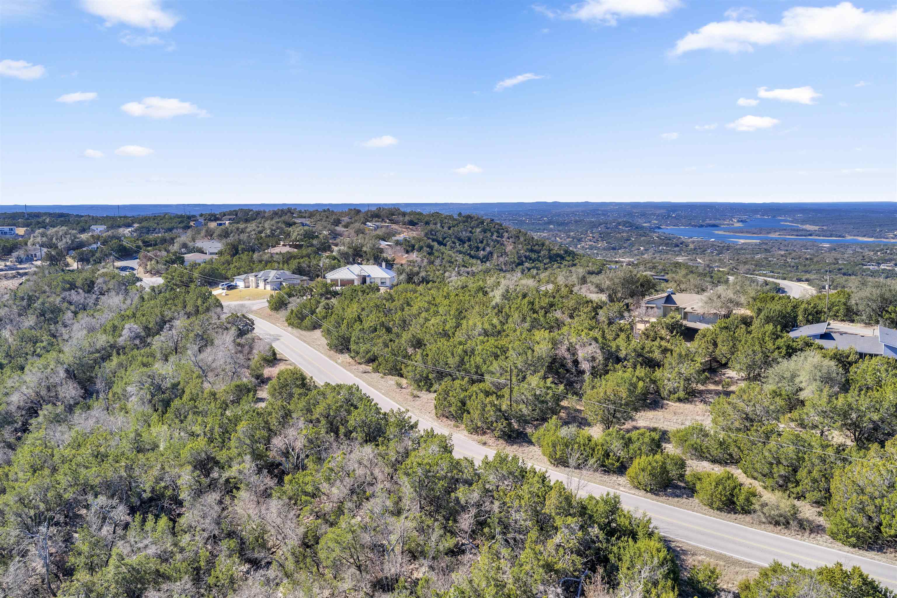 8614 Bar K Ranch Road Lago Vista, TX 78645 - Photo 17 of 26 a view of a city with lush green forest