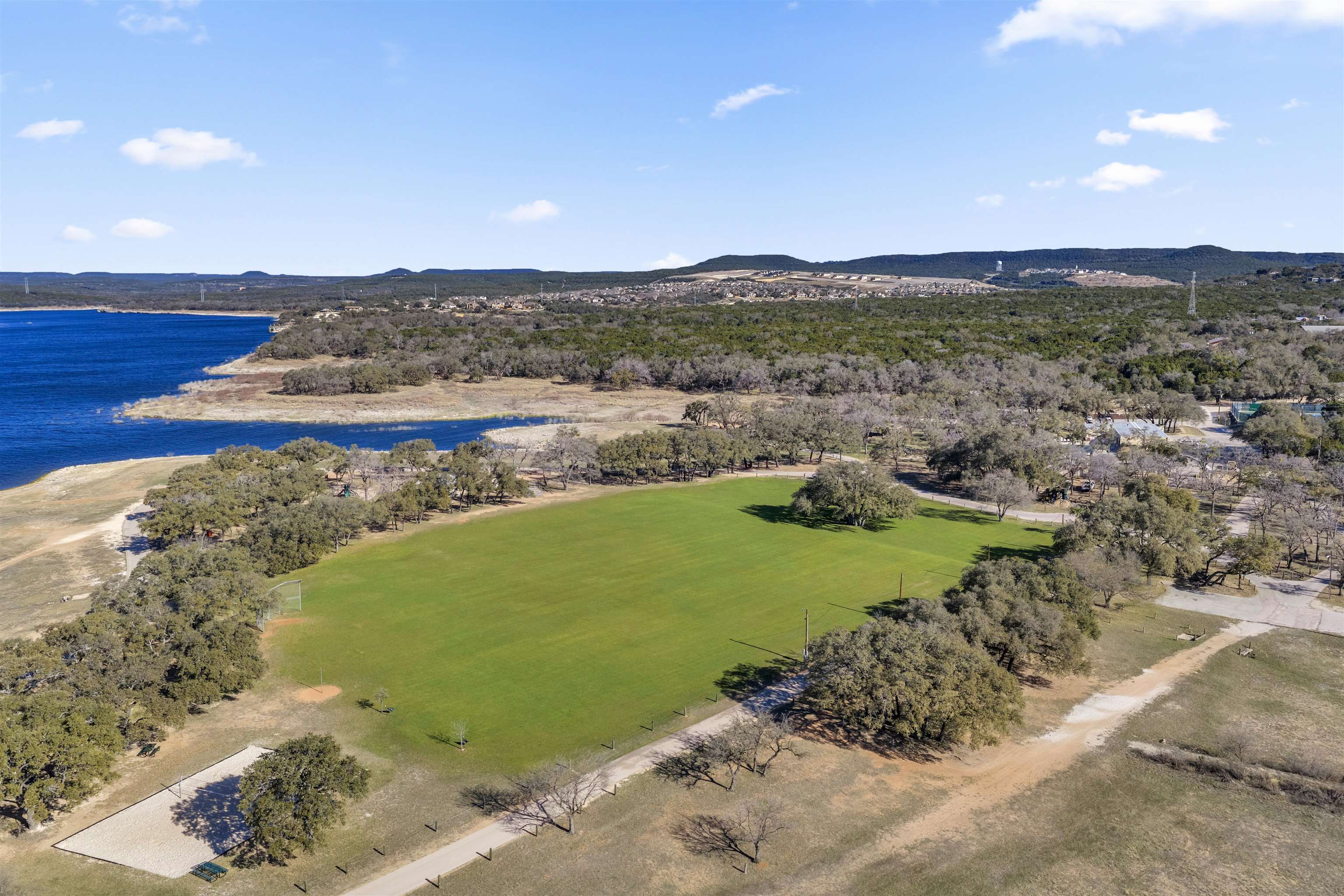 8614 Bar K Ranch Road Lago Vista, TX 78645 - Photo 19 of 26 a view of a lake with a mountain