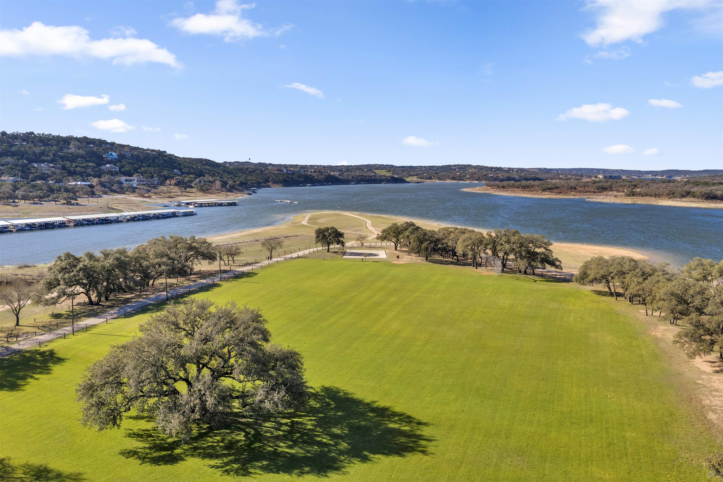 8614 Bar K Ranch Road Lago Vista, TX 78645 - Photo 20 of 26 a view of an swimming pool and an outdoor seating