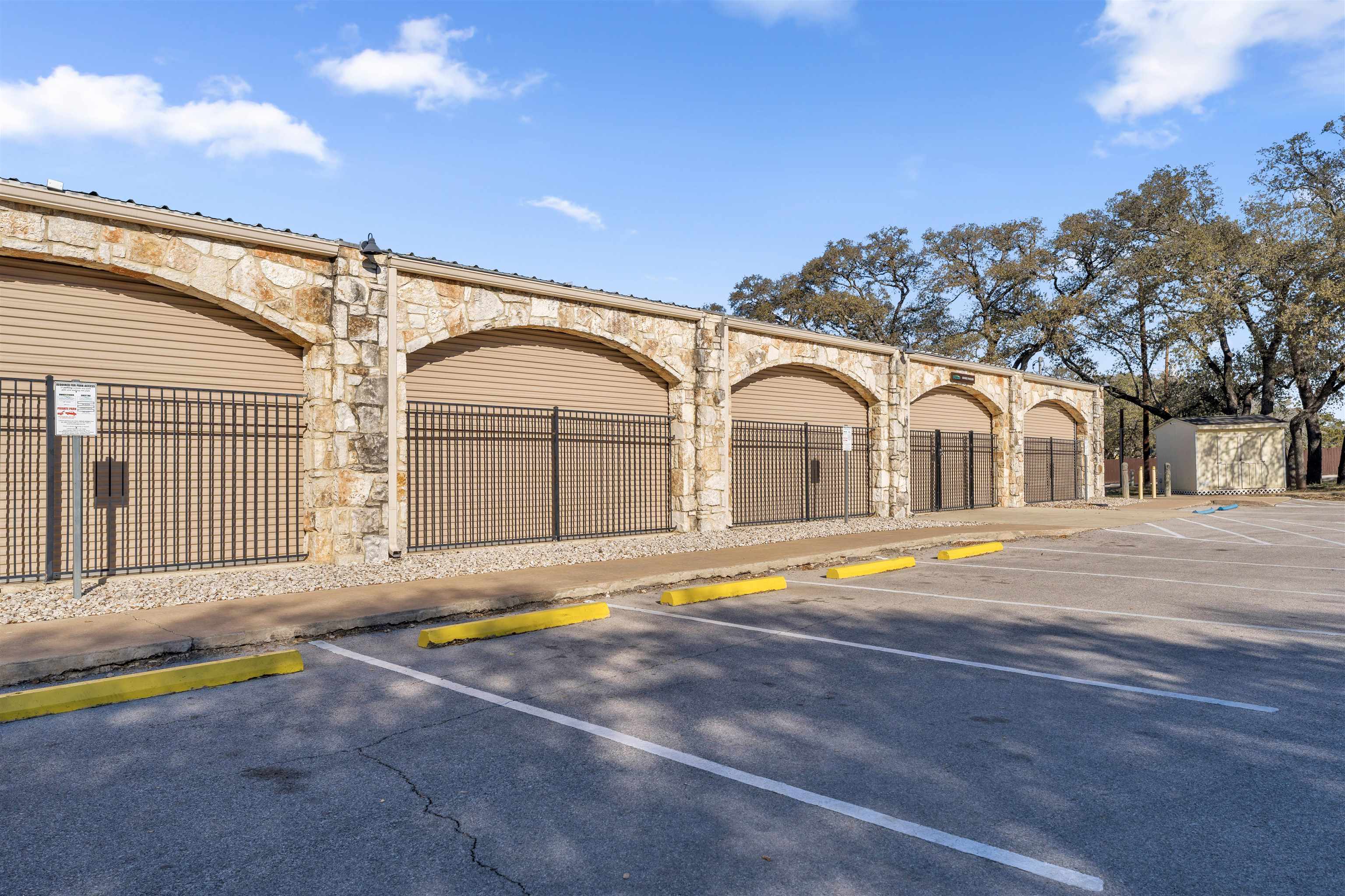 8614 Bar K Ranch Road Lago Vista, TX 78645 - Photo 24 of 26 a view of pool with umbrella and wooden fence