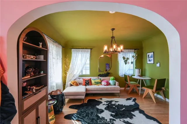a kitchen with stainless steel appliances granite countertop a stove a sink and white cabinets