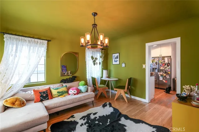 a view of a room with wooden floor