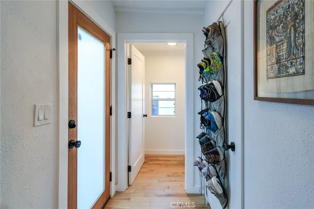 a kitchen with granite countertop white cabinets and black appliances