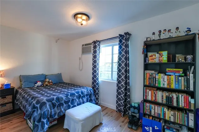 a bathroom with a granite countertop bathtub shower and toilet