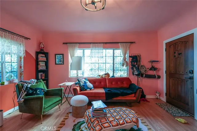 a living room with lots of furniture and a flat screen tv