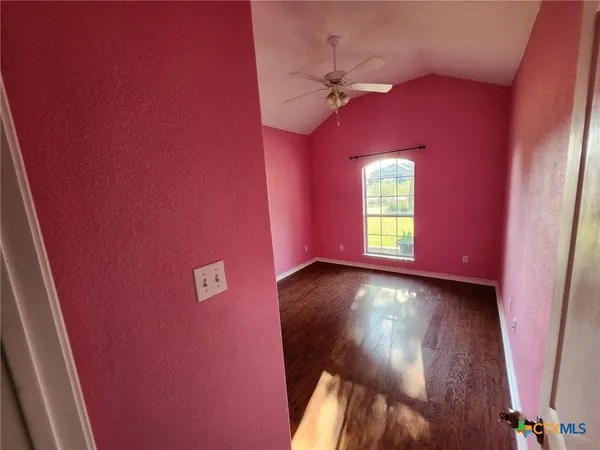 a view of a livingroom with furniture window and wooden floor
