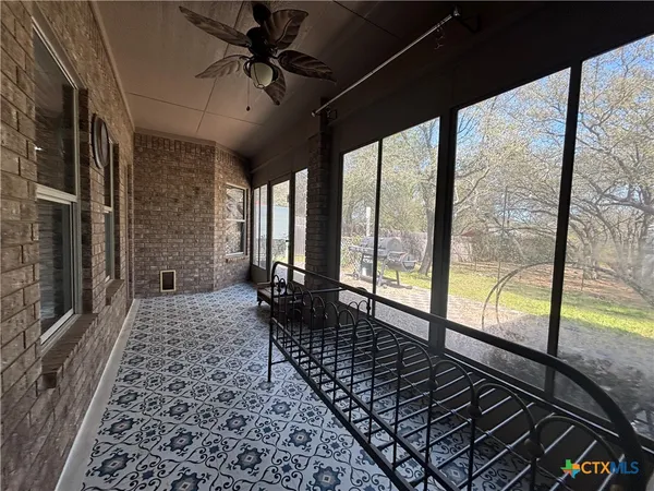 a view of a yard with a tree