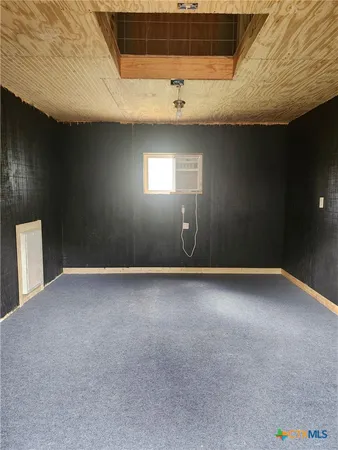 en empty room with windows