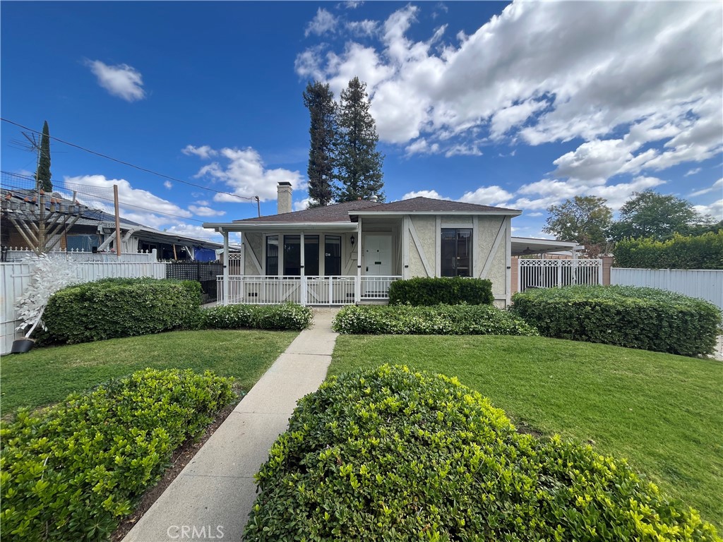 18029 Santa Rita Street Encino, CA 91316 - Photo 1 of 20 a front view of a house with a yard