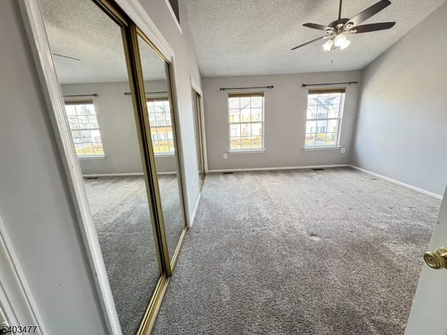 a view of an empty room with glass door