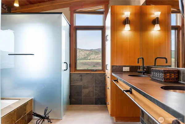 a view of a bathroom with a sink and a mirror