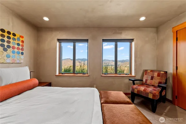 a bedroom with furniture and window