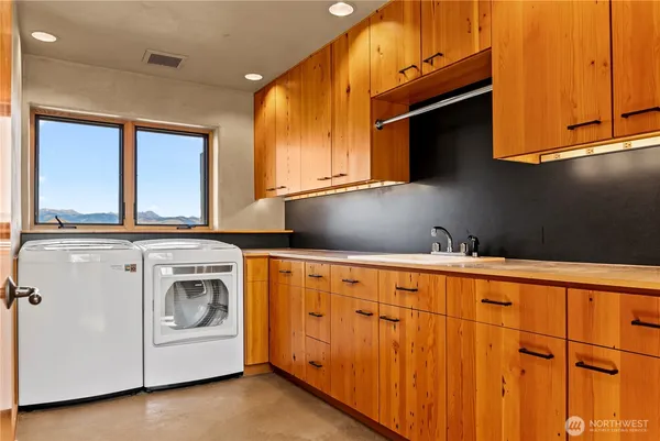 a view of a kitchen with a large window