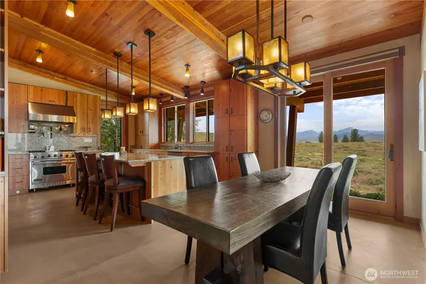 a view of a dining room with furniture window and outside view