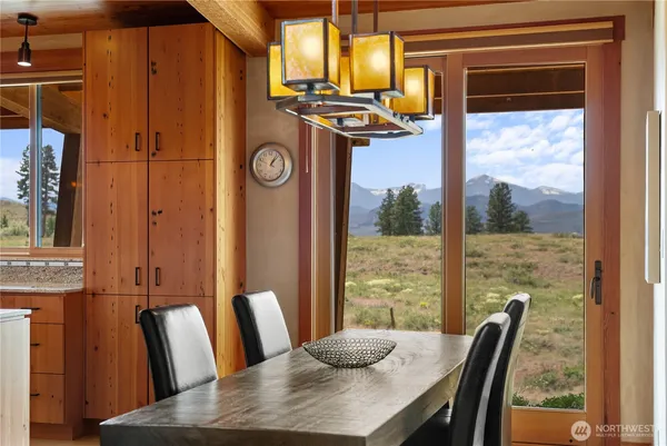a view of a dining room with furniture window and outside view