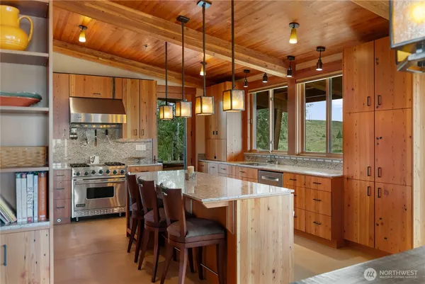 a kitchen with a stove a sink and a refrigerator