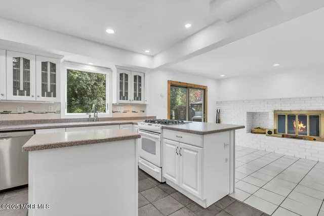 a kitchen with sink and cabinets