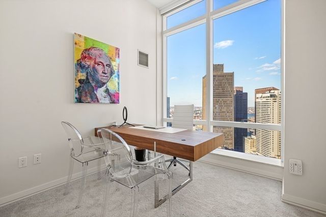 a view of a workspace with furniture