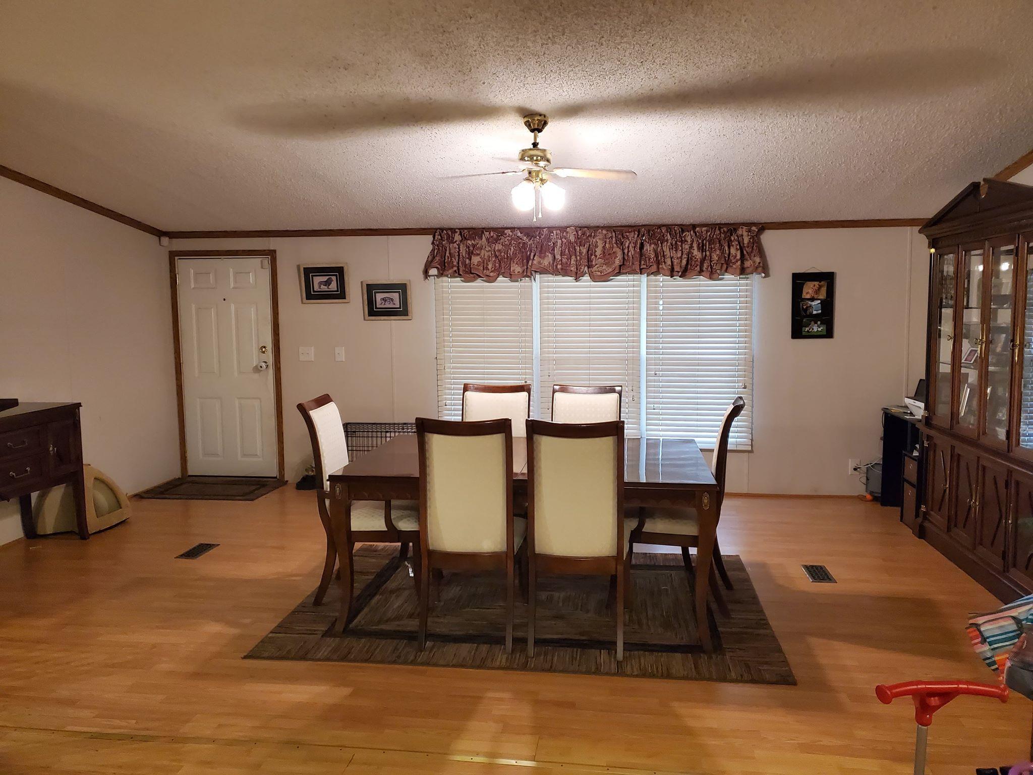 105 Carolina Road Rocky Mount, VA 24151 - Photo 13 of 32 a view of a dining room with furniture and wooden floor