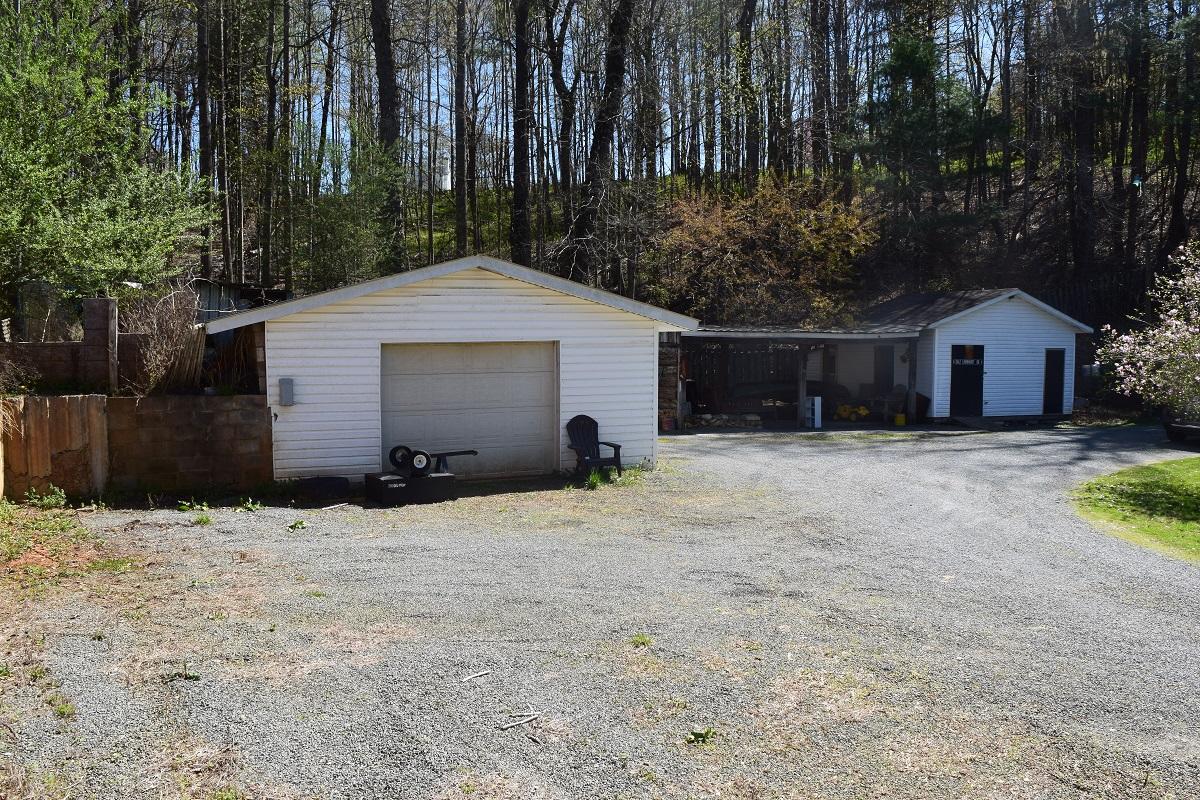 105 Carolina Road Rocky Mount, VA 24151 - Photo 8 of 32 a front view of house with yard and trees in the background