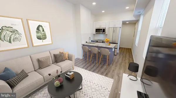 a living room with furniture a flat screen tv and a window