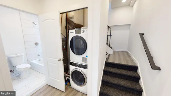 a view of a hallway with washer and dryer