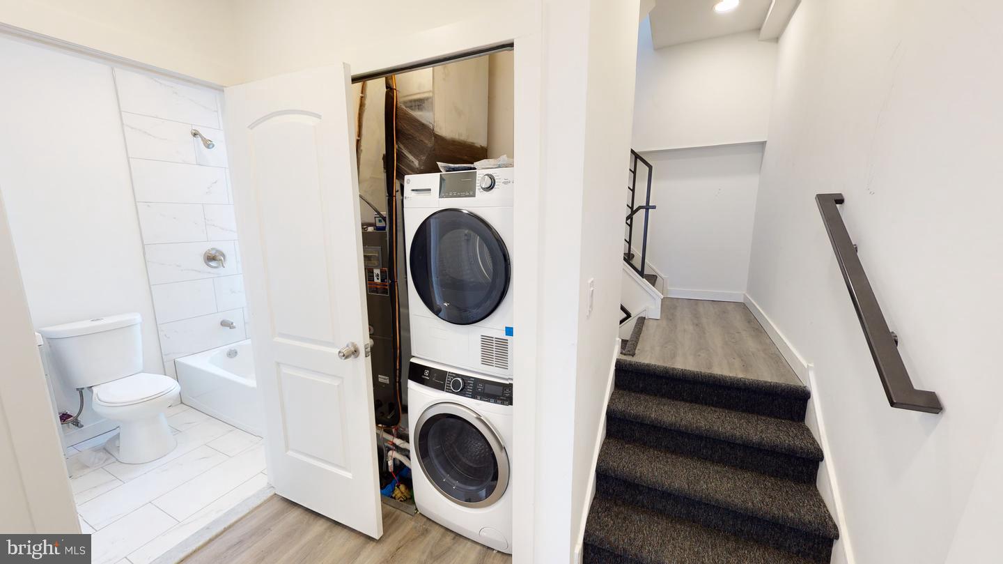 2131 North 8th Street, Unit 2 Philadelphia, PA 19122 - Photo 9 of 19 a view of a hallway with washer and dryer