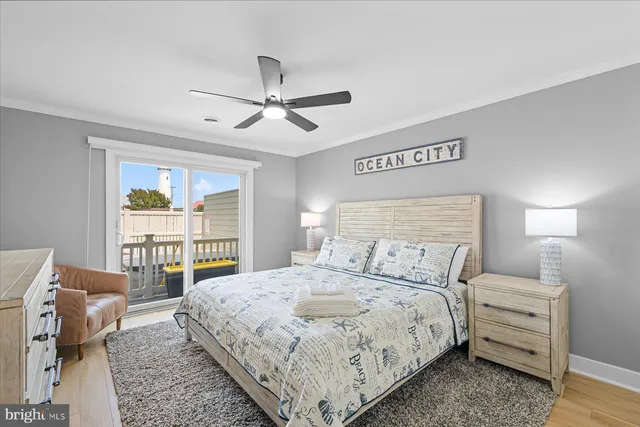 a bedroom with a large bed and a large window