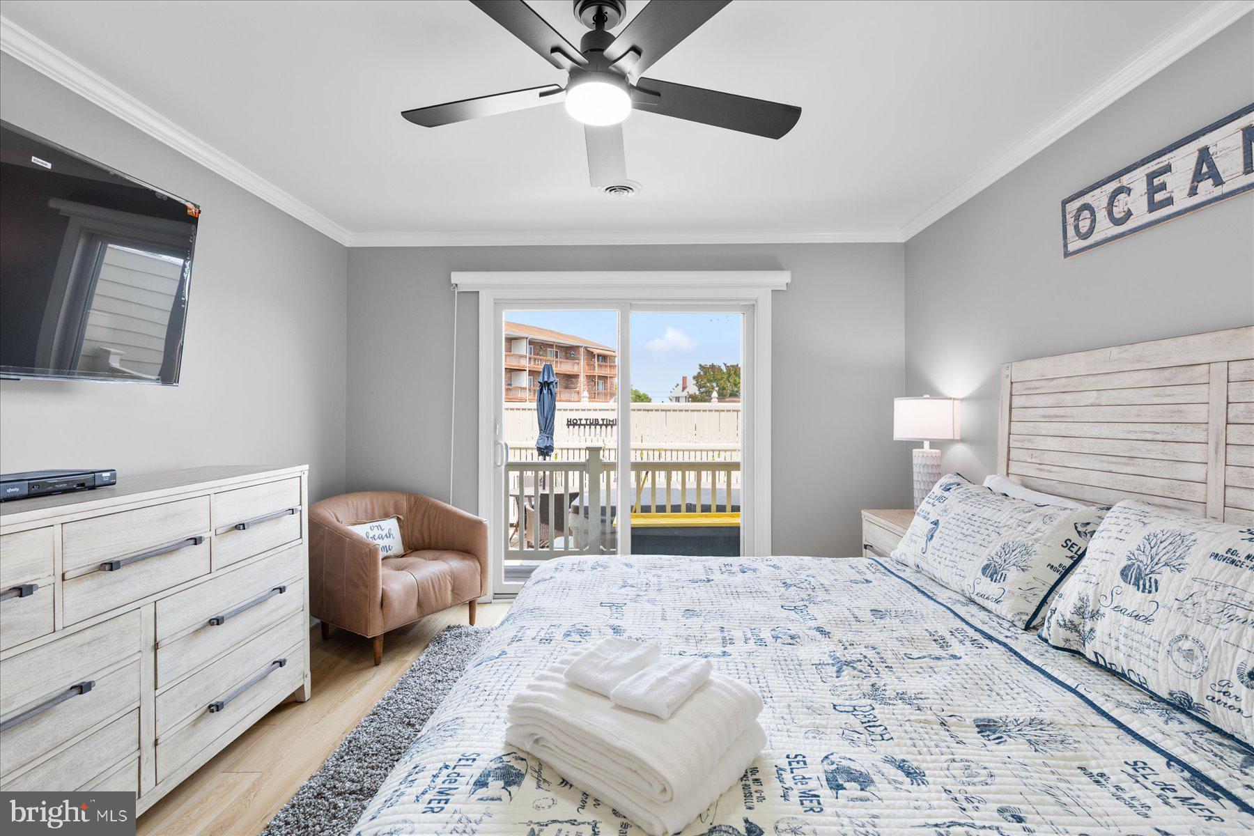 14409 Lighthouse Avenue, Unit 2 Ocean City, MD 21842 - Photo 19 of 39 a bedroom with a large bed and a window