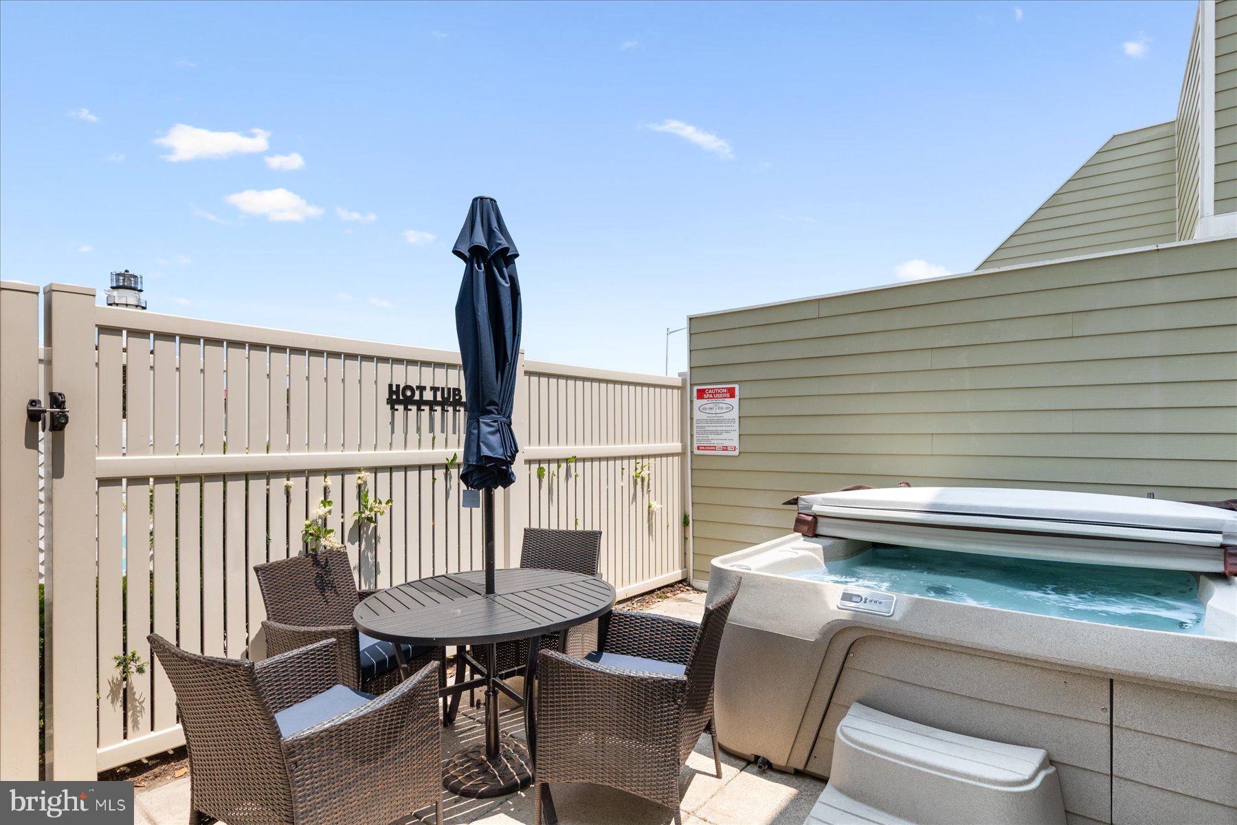 14409 Lighthouse Avenue, Unit 2 Ocean City, MD 21842 - Photo 34 of 39 a view of a chairs and table in the balcony