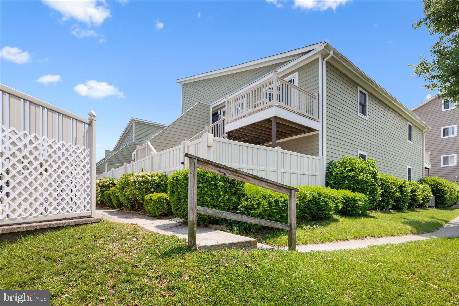 14409 Lighthouse Avenue, Unit 2 Ocean City, MD 21842 - Photo 39 of 39 a front view of a house with a yard