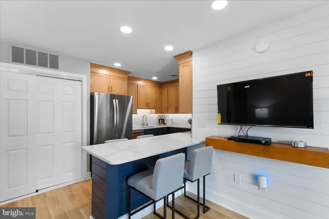 a room with furniture and a flat screen tv