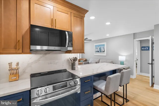 a kitchen with a sink appliances and cabinets