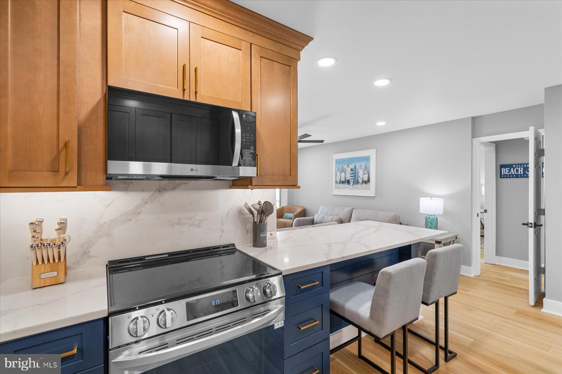 14409 Lighthouse Avenue, Unit 2 Ocean City, MD 21842 - Photo 8 of 39 a kitchen with a sink appliances and cabinets