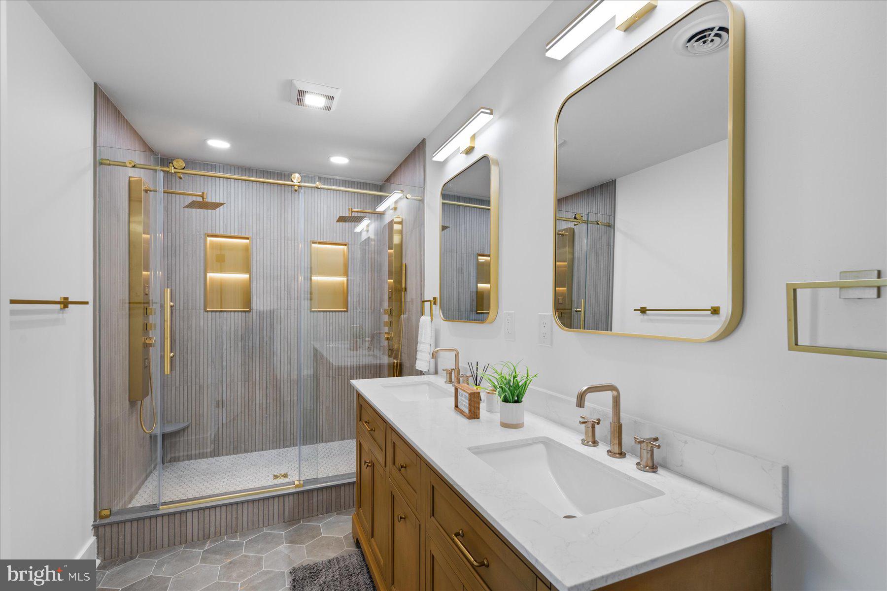 14409 Lighthouse Avenue, Unit 2 Ocean City, MD 21842 - Photo 10 of 39 a bathroom with a sink vanity granite shower and a mirror