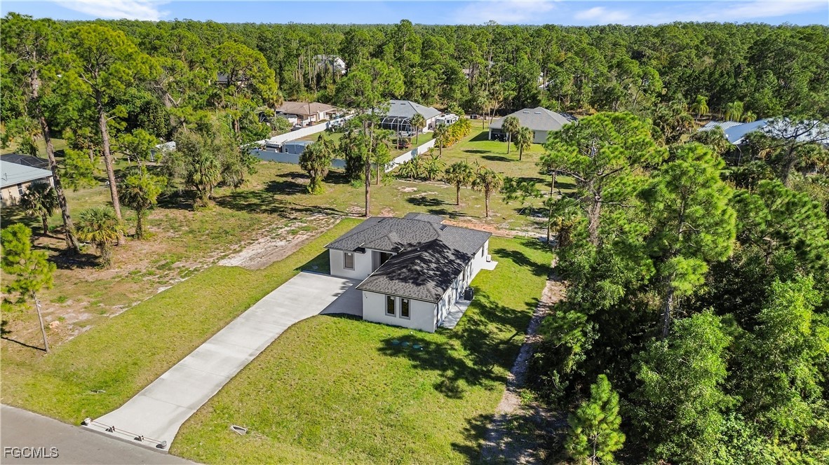 714 Hamilton Avenue Lehigh Acres, FL 33972 - Photo 2 of 30 a view of yard and swimming pool