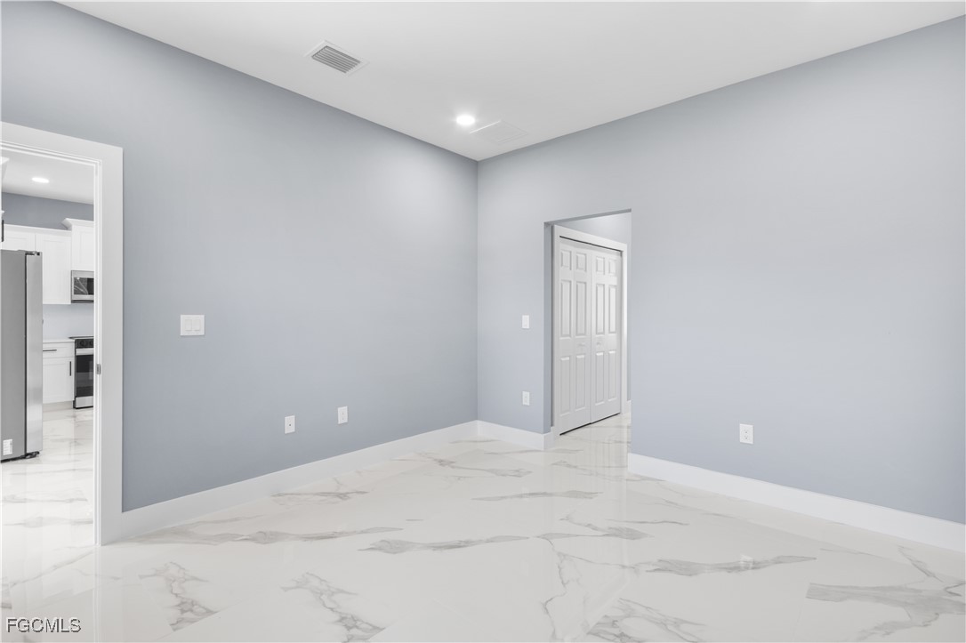 714 Hamilton Avenue Lehigh Acres, FL 33972 - Photo 21 of 30 a view of an empty room