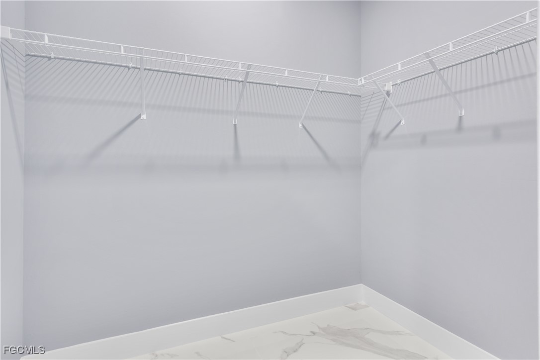 714 Hamilton Avenue Lehigh Acres, FL 33972 - Photo 24 of 30 a view of a room with racks on the wall