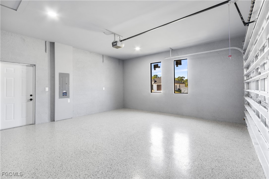 714 Hamilton Avenue Lehigh Acres, FL 33972 - Photo 27 of 30 a view of an empty room with a window and a kitchen