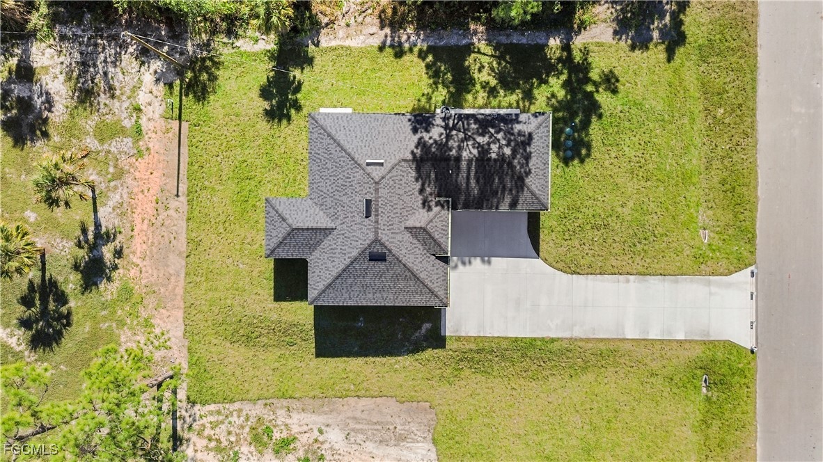 714 Hamilton Avenue Lehigh Acres, FL 33972 - Photo 6 of 30 an aerial view of a house with a swimming pool