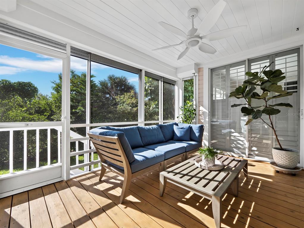 160 Blackwall Court Boca Grande, FL 33921 - Photo 21 of 56 a living room with furniture and a large window