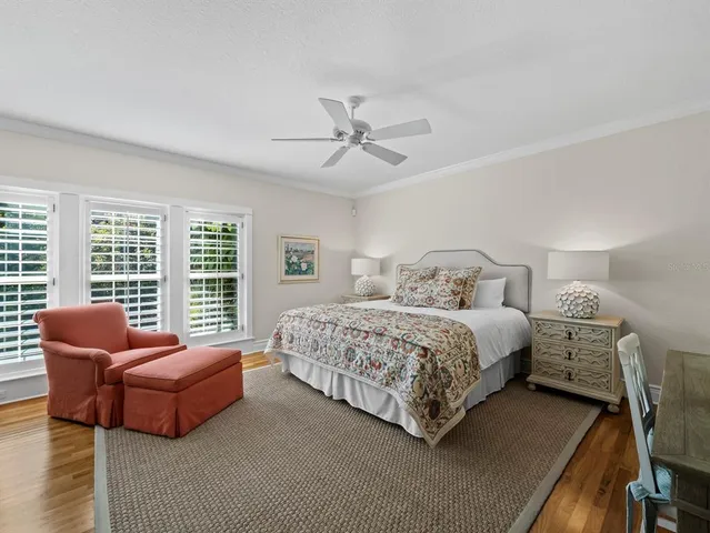 a view of staircase with lots of frames on wall