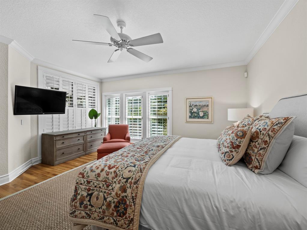 160 Blackwall Court Boca Grande, FL 33921 - Photo 24 of 56 a bedroom with a large bed and a flat screen tv