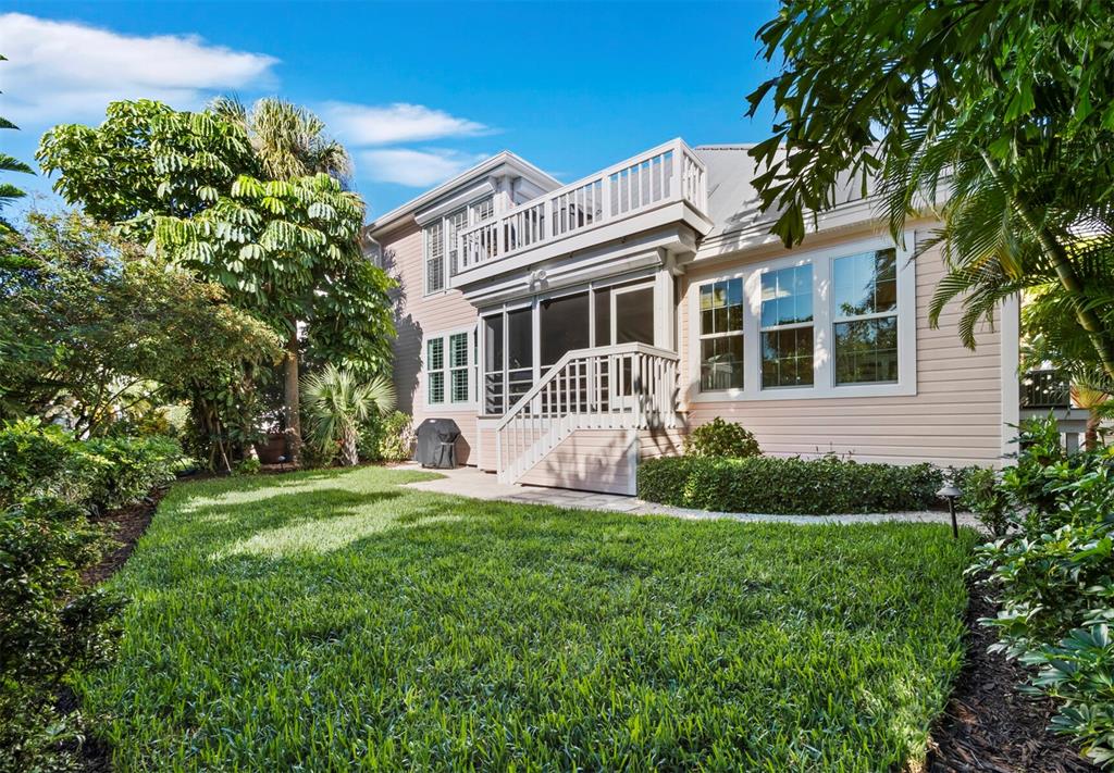 160 Blackwall Court Boca Grande, FL 33921 - Photo 37 of 56 a front view of a house with a garden and yard