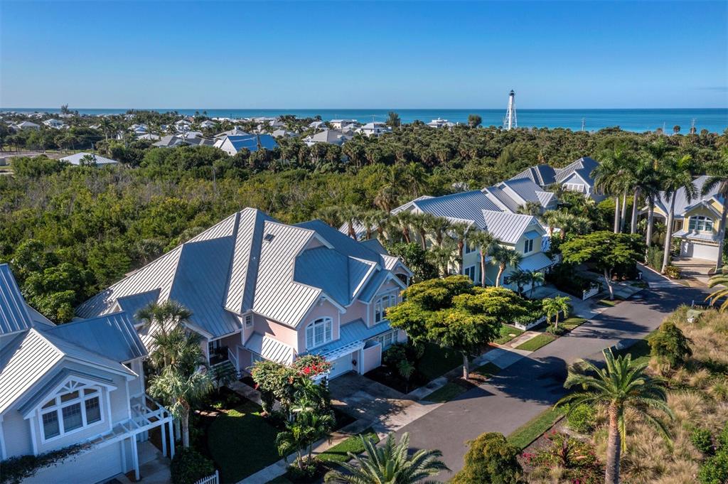 160 Blackwall Court Boca Grande, FL 33921 - Photo 43 of 56 an aerial view of a house with a yard and lake view